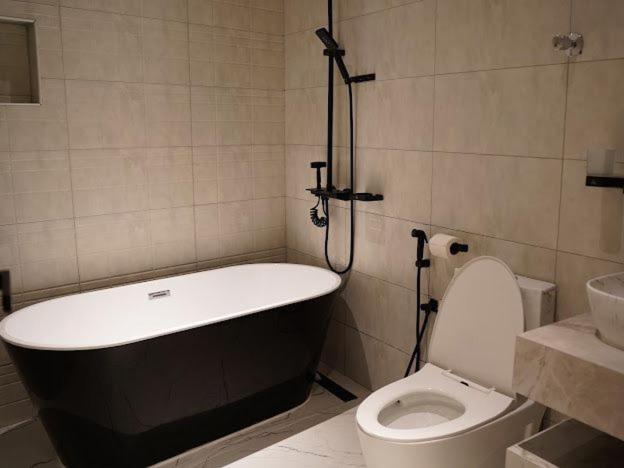 Апартаменти Lavenue Resthouse Нізва Номер фото